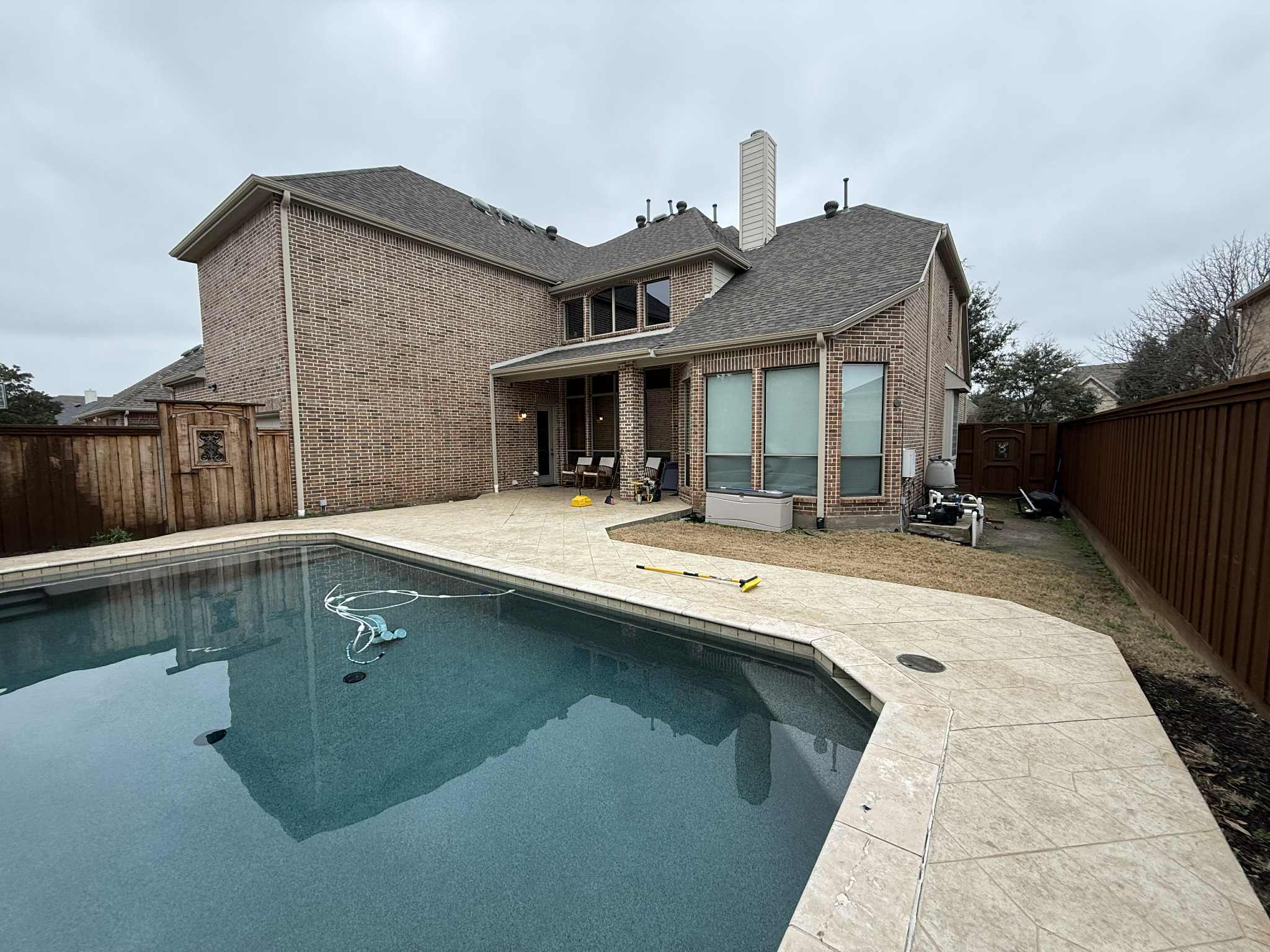 Covered patio outdoor living space by Innovation General Construction LLC